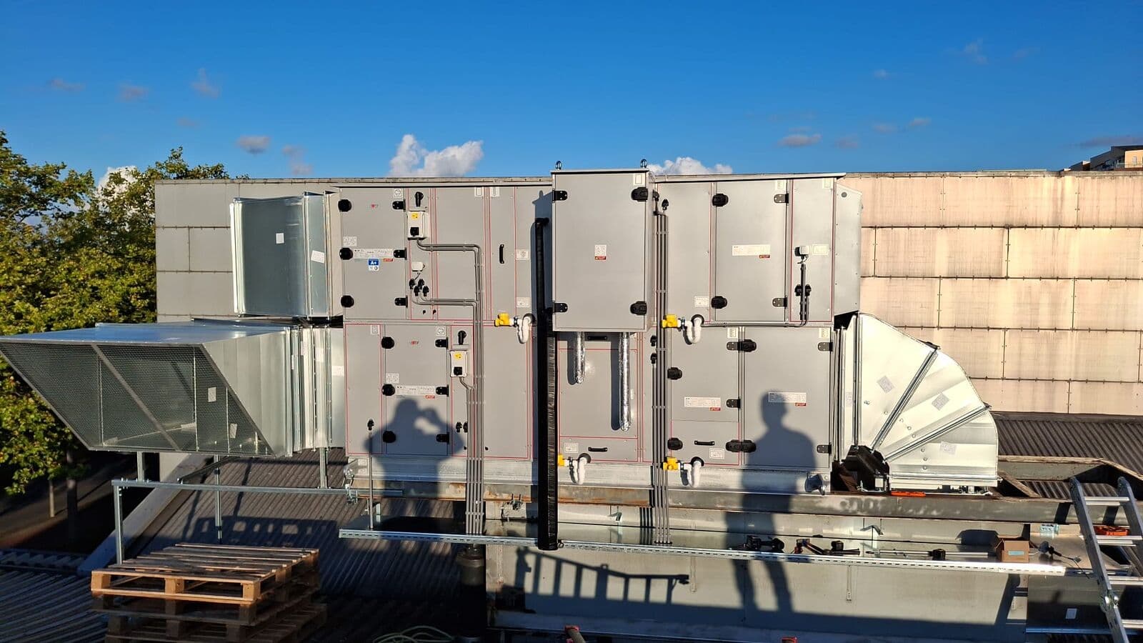Air handling units in a row on a flat roof
